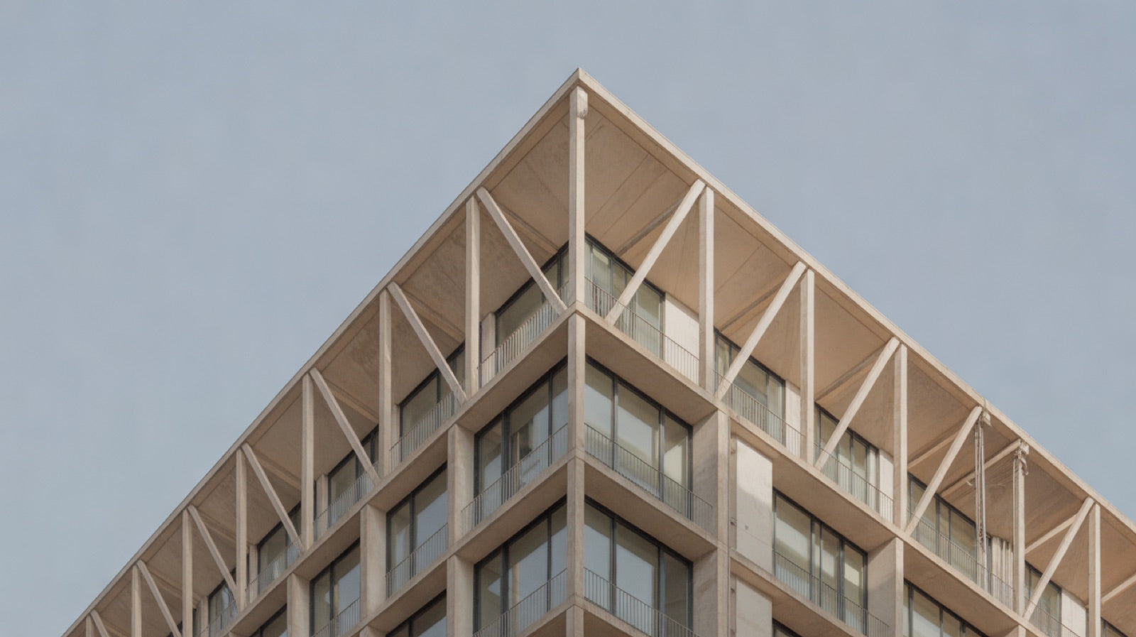High-Tech Architecture: a building with an exposed external steel frame, diagonal bracing and brightly painted service ducts on its facade